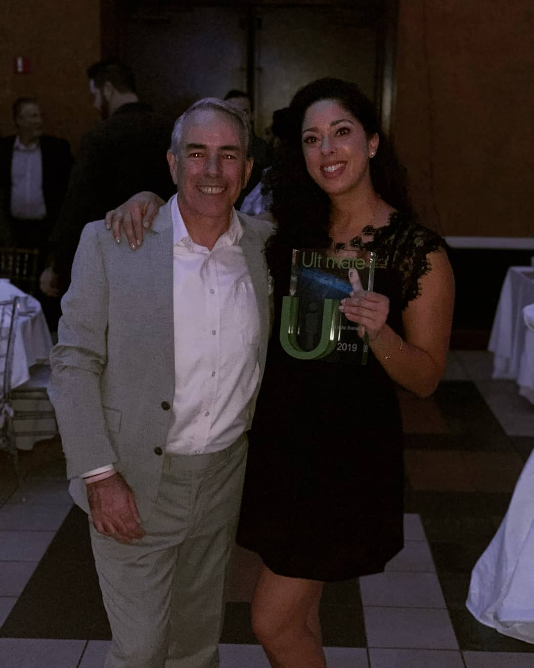 Leslie receiving Ultimate U 2019 award