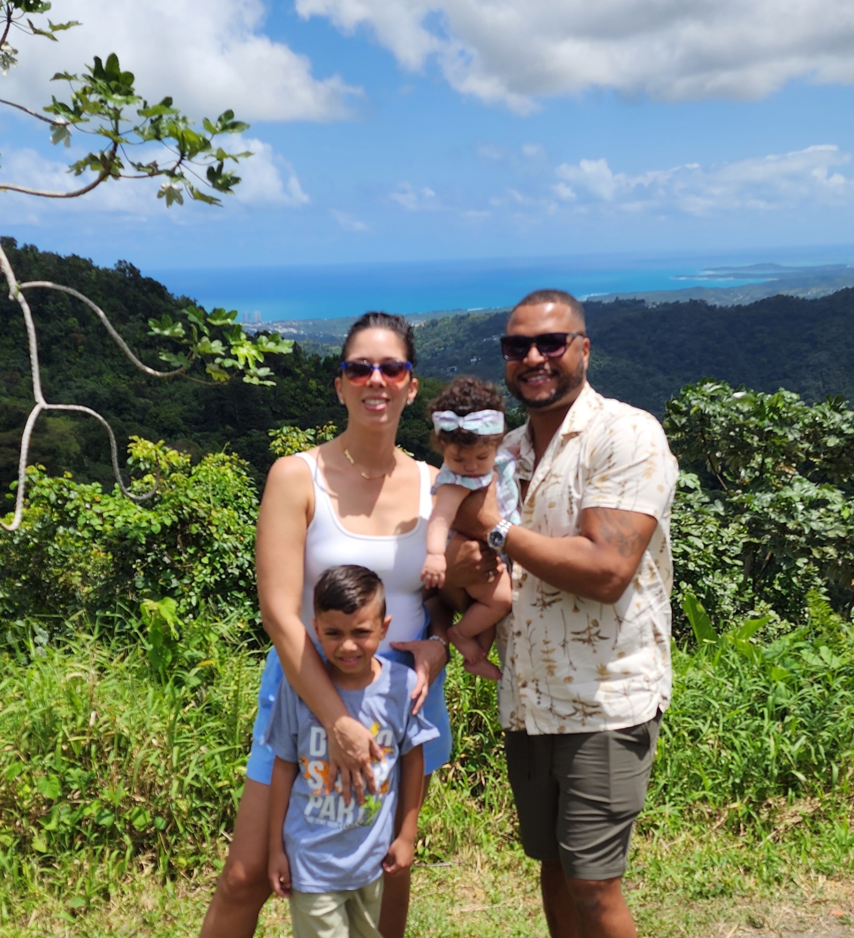Leslie with her family overlooking the coastline